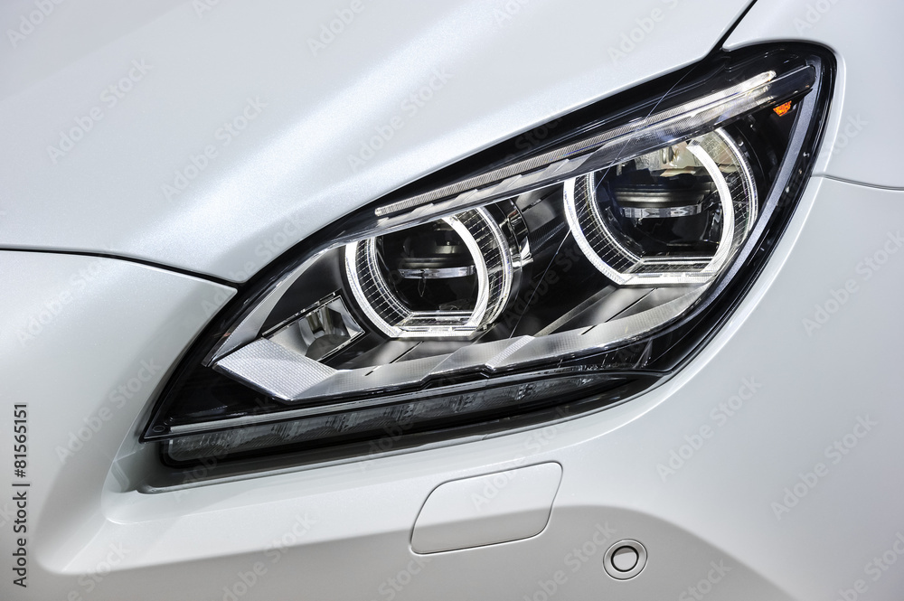 Headlight with led lamps and hood of white sport modern car