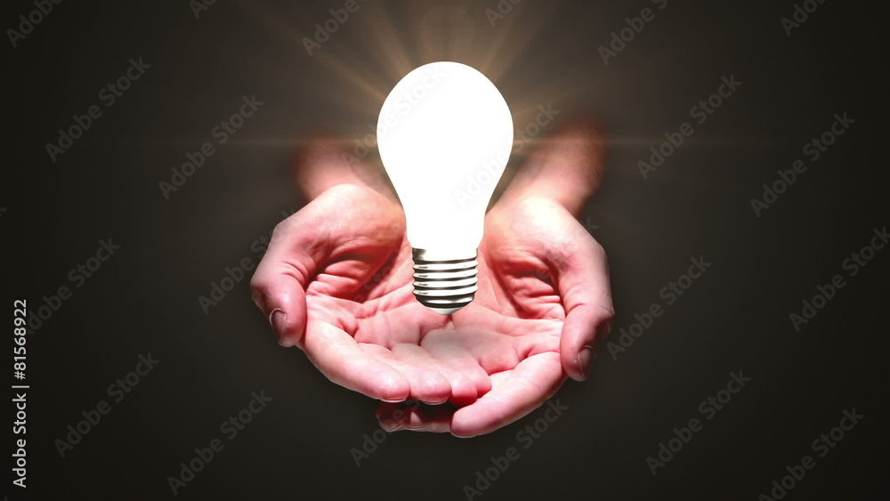 Hands presenting light bulb