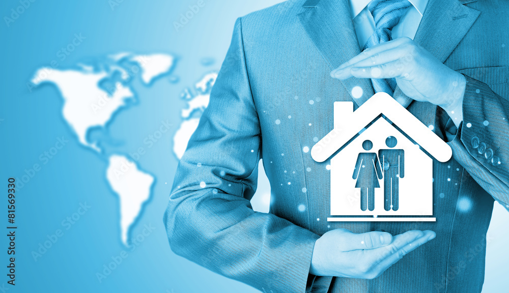 businessman protecting family in home with hands businessman protecting family in home with hands