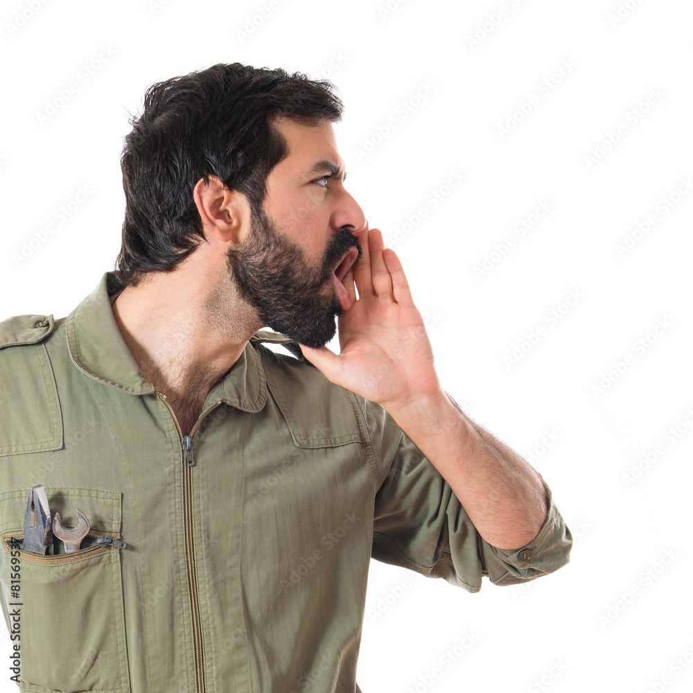 Mechanic shouting over white background Mechanic shouting over white background
