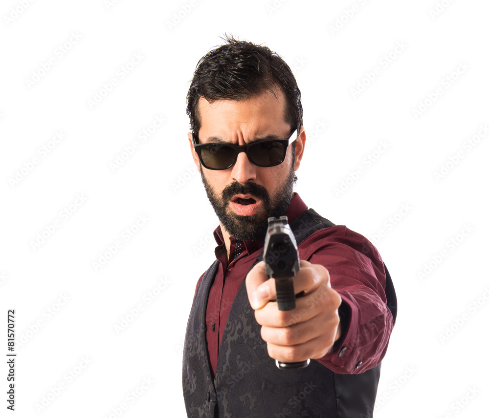Man wearing waistcoat shooting with a pistol Man wearing waistcoat shooting with a pistol