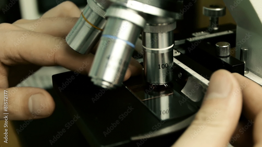 Male Scientist On Microscope Male Scientist On Microscope