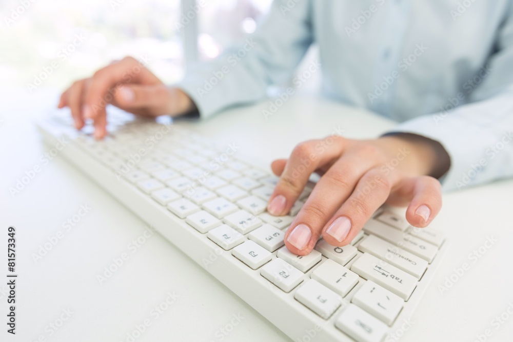 Network. Female office worker typing on the keyboard Network. Female office worker typing on the keyboard