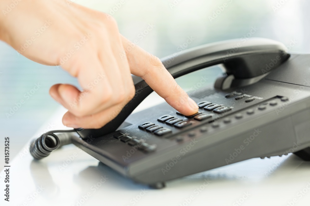 Agent. Detail of using a telephone keypad. Shallow dof. Agent. Detail of using a telephone keypad. Shallow dof.