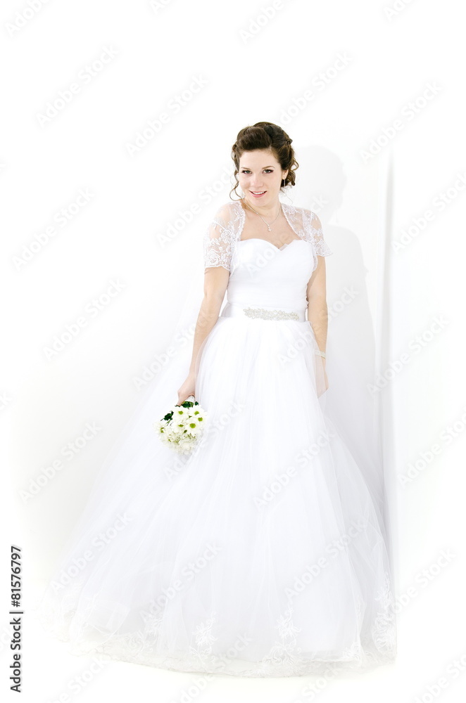 bride with a bouquet of white flowers. studio. bride with a bouquet of white flowers. studio.