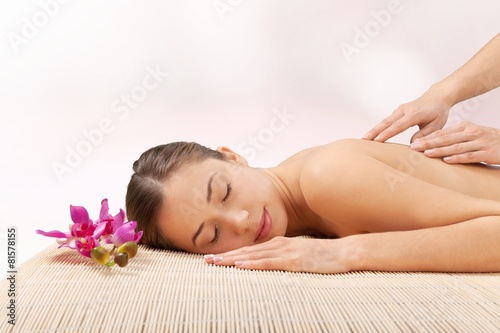 Spa. Young attractive woman getting spa treatment over white