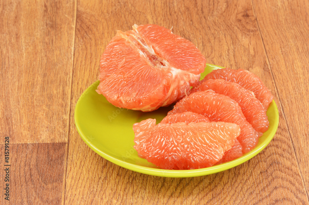 Ripe grapefruit on a wooden background Ripe grapefruit on a wooden background