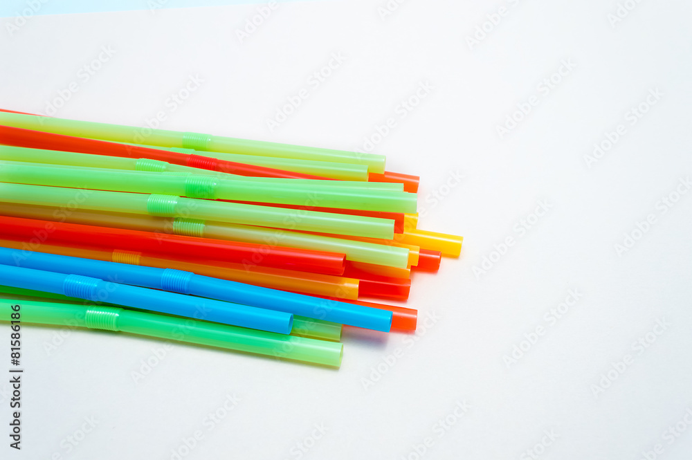 Colored plastic drinking straws on a white background Colored plastic drinking straws on a white background