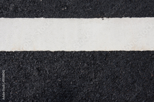 white paint line on asphalt road © chartgraphic