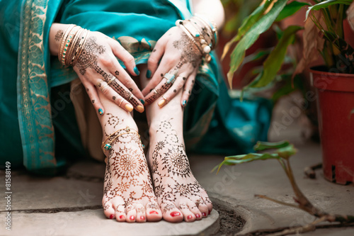 Indian hindu bride with mehendi heena on hands. photo