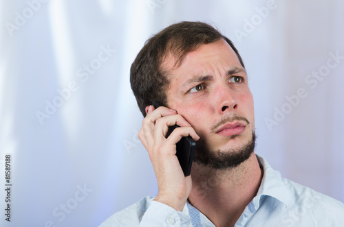 young handsome man using cell phone