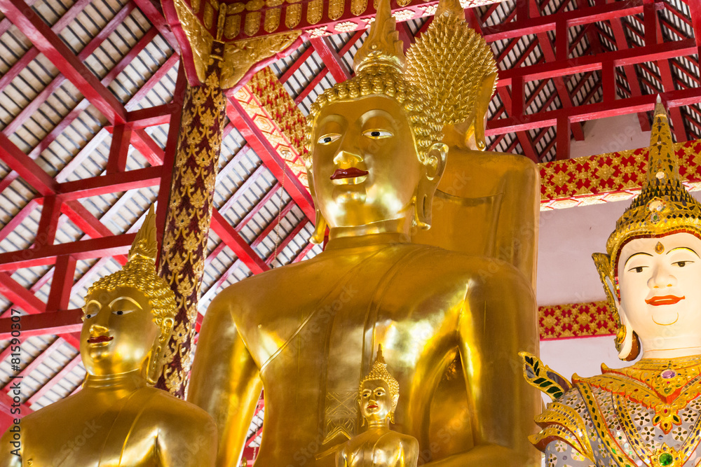 asian angel and golden buddha statue