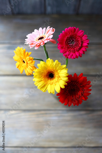 Bouquet of gerberas on the boards