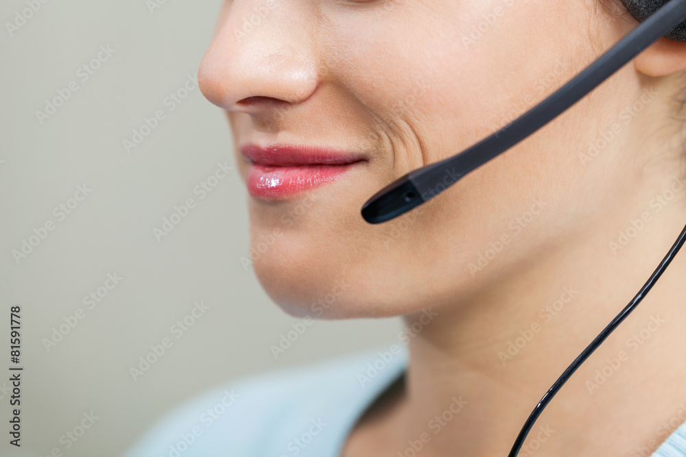 Female Call Center Employee Using Mic In Office Female Call Center Employee Using Mic In Office