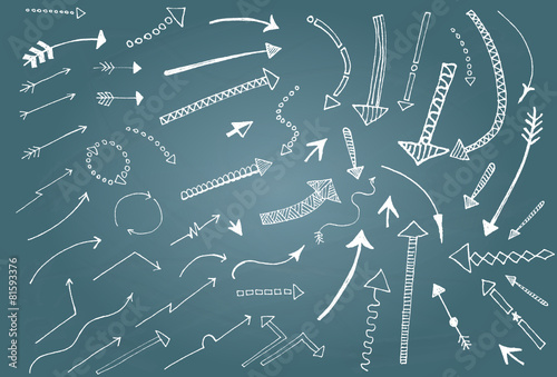 Hand drawn arrow icons set on blue chalk board