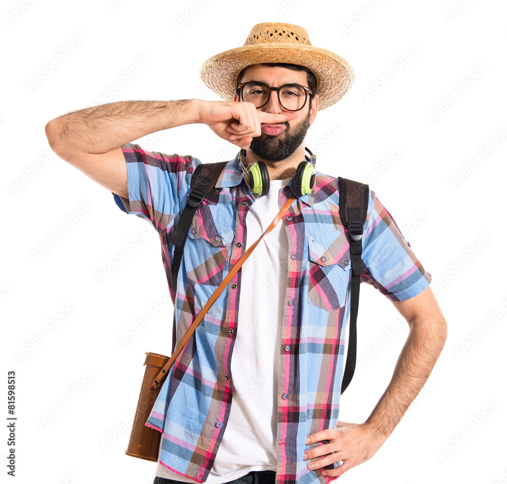 Tourist doing moustache sign
