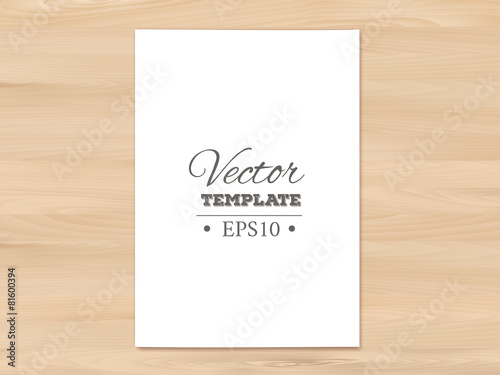 Template of blank paper sheet on a wooden background