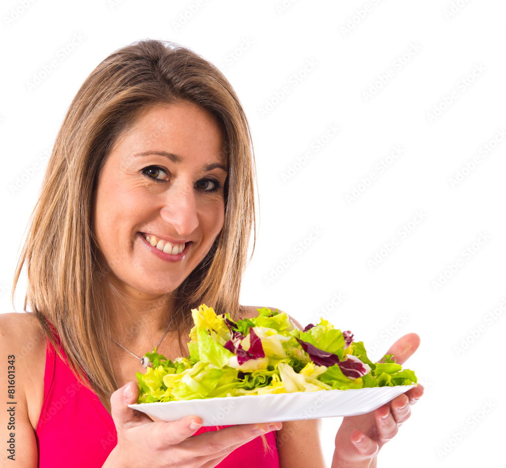 Sport woman holding a salad