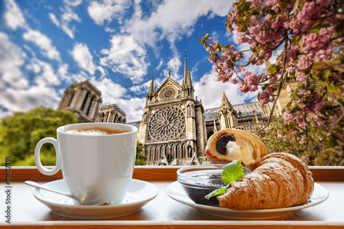 Photography Notre Dame cathedral with coffee and croissants in Paris, France