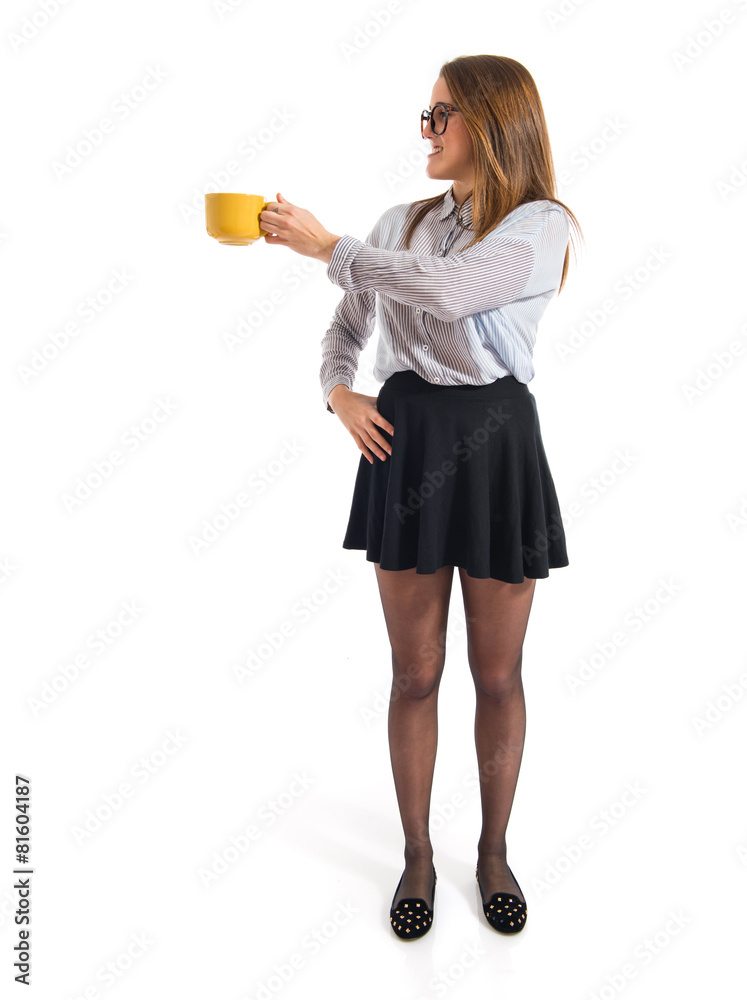 Girl holding a cup of coffee Girl holding a cup of coffee