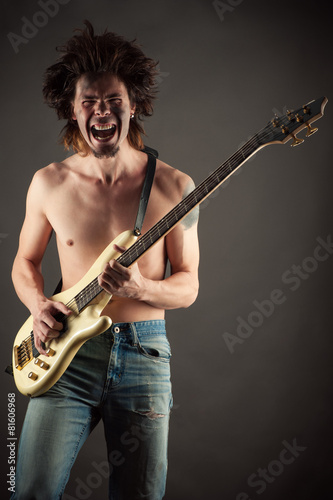 brutal man musician playing guitar