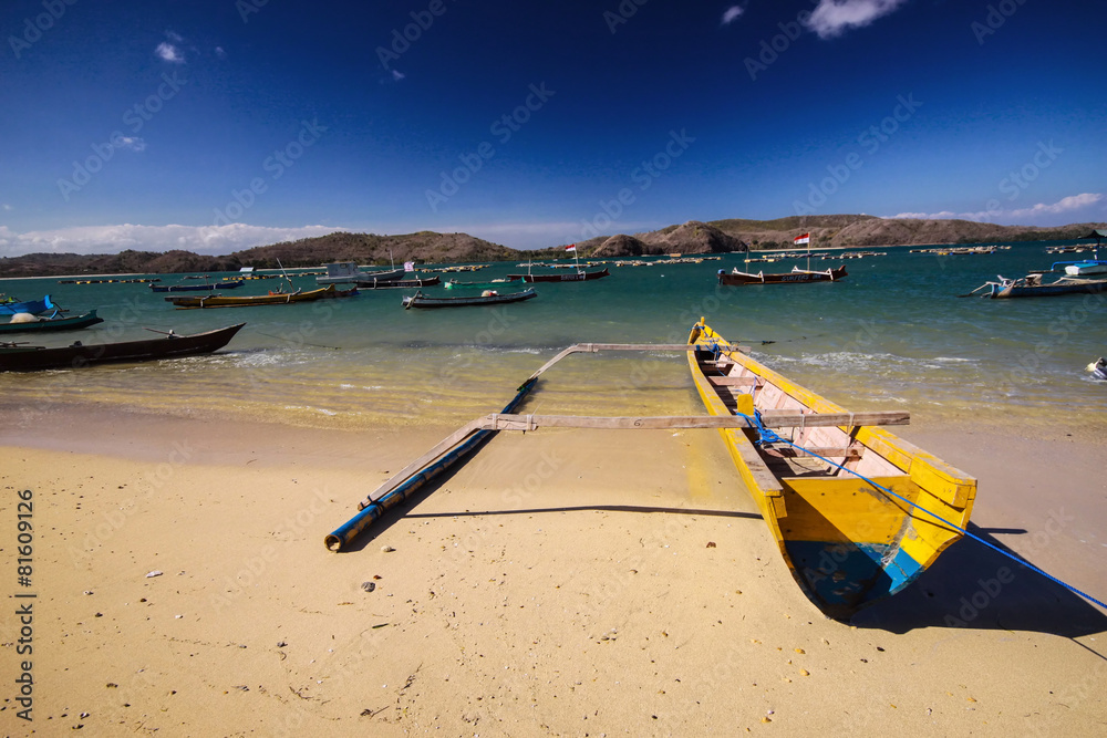 one rocker catamaran on the coast of Lombok, Indonesia one rocker catamaran on the coast of Lombok, Indonesia