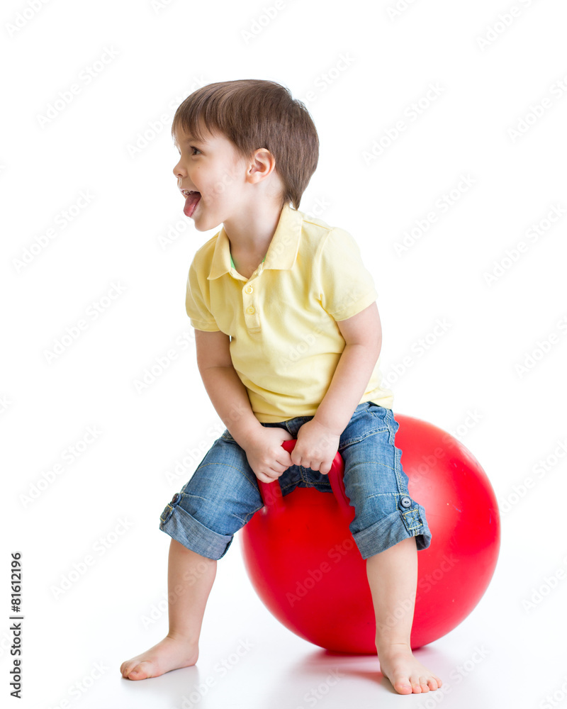happy child jumping on bouncing ball happy child jumping on bouncing ball