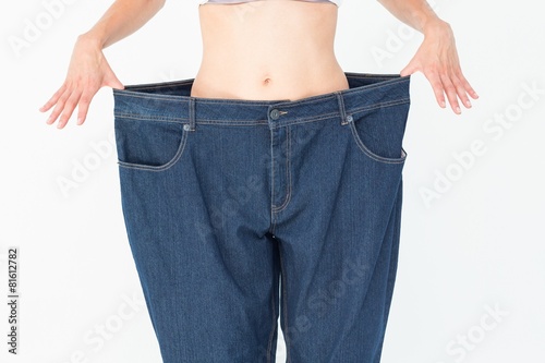Woman wearing too large pants