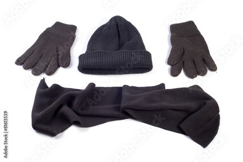 Winter cap, scarf and gloves isolated on white background
