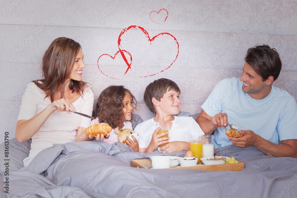 Composite image of family having breakfast in bed Composite image of family having breakfast in bed