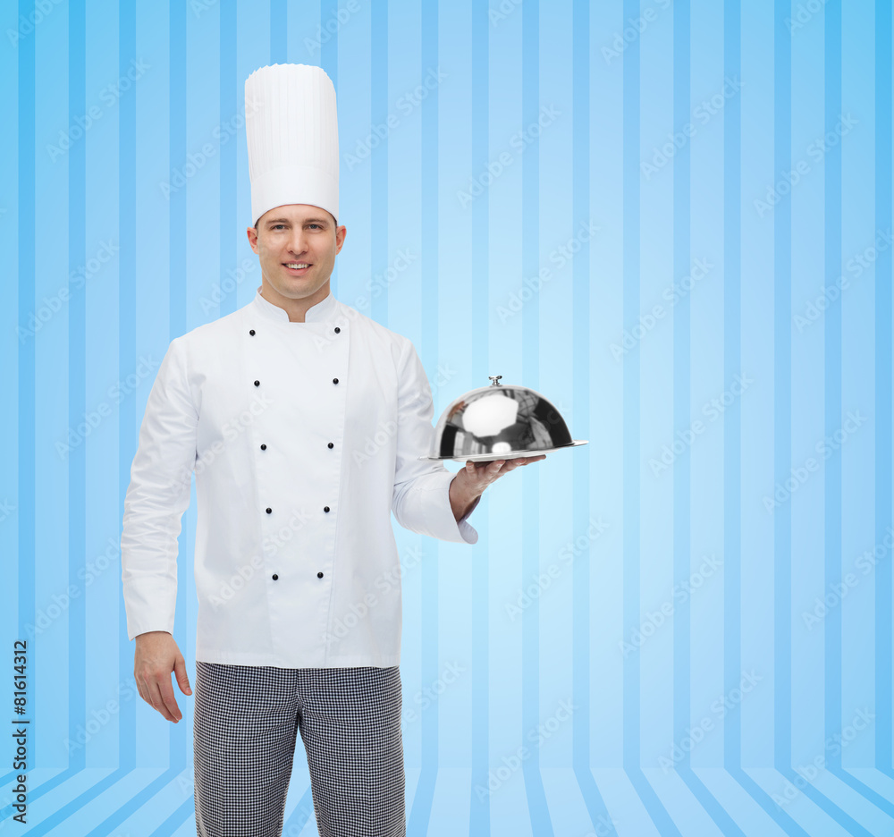 happy male chef cook holding cloche