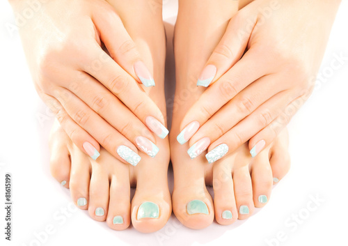 beautiful feet with turquoise pedicure isolated