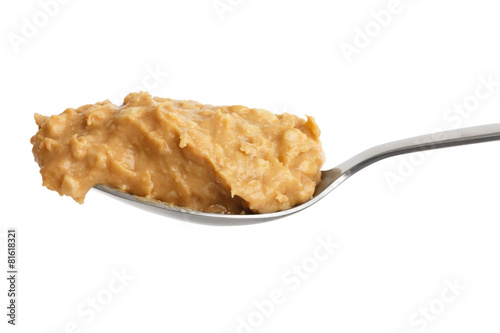 Obraz na plátně Crunchy peanut butter on metal spoon.