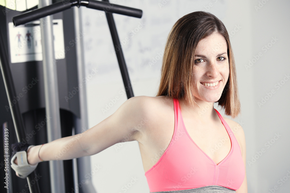Strong woman weightlifting at the gym looking happy Strong woman weightlifting at the gym looking happy