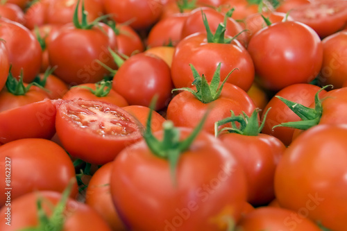 red tomatoes on display in the city bazaar