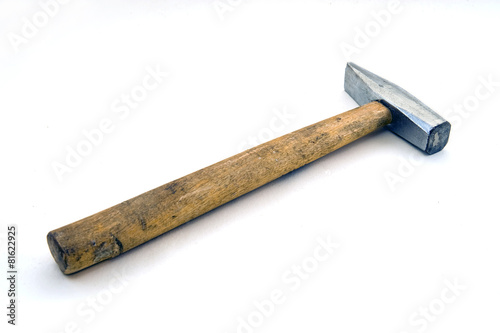 old hammer on a white background