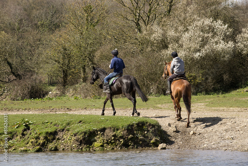 Horse riders on the Ogmore River in South Wales UK © petert2