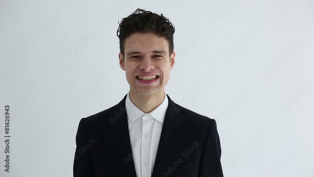 Happy successful businessman in formal suit rejoices and has fun Happy successful businessman in formal suit rejoices and has fun