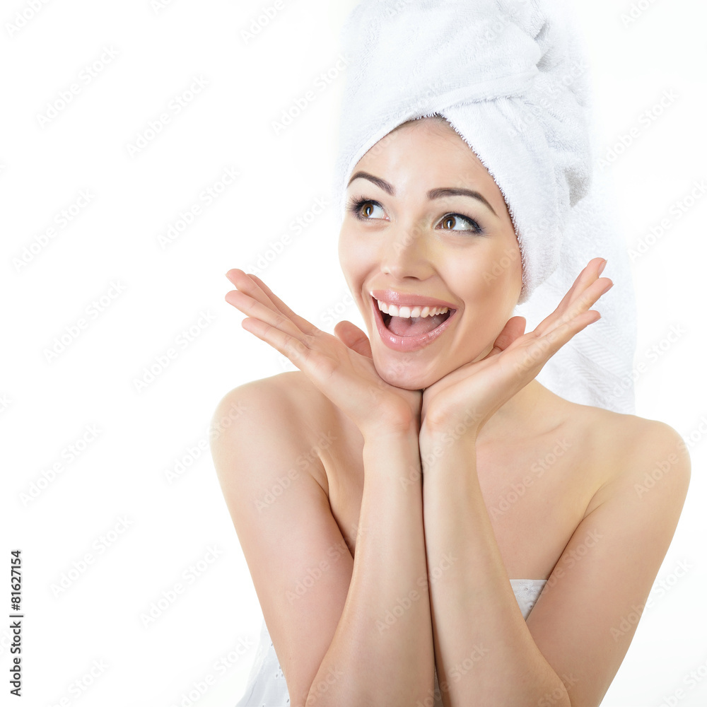 Fresh clean beautiful smiling woman wrapped in bath towels. Heal
