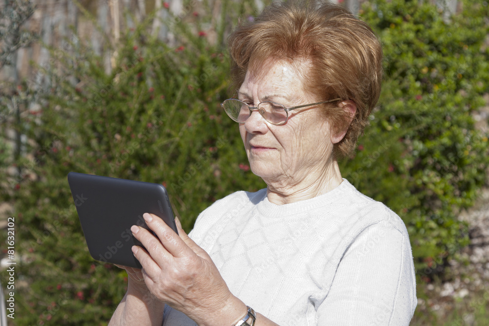 elderly woman with computer technology