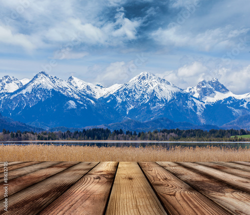 Wooden planks floor with Bavarian Alps landscape