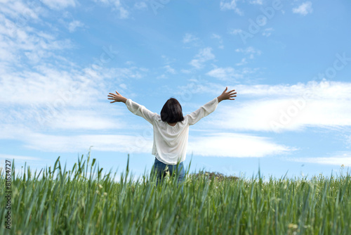 Woman in green field