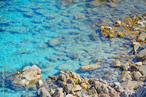 rocks in Capo Testa clear water