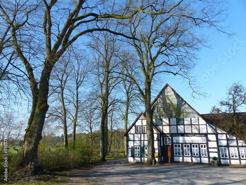 Altes Fachwerk des Ausflugslokal Bartholdskrug im Frühling bei Sonnenschein in Lipperreihe bei Oerlinghausen und Bielefeld am Hermannsweg im Teutoburger Wald in Ostwestfalen-Lippe photo