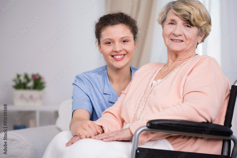 Woman sitting on a wheelchair Woman sitting on a wheelchair