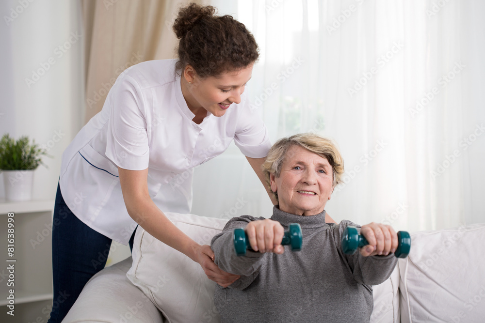 Obraz premium Old woman training at home