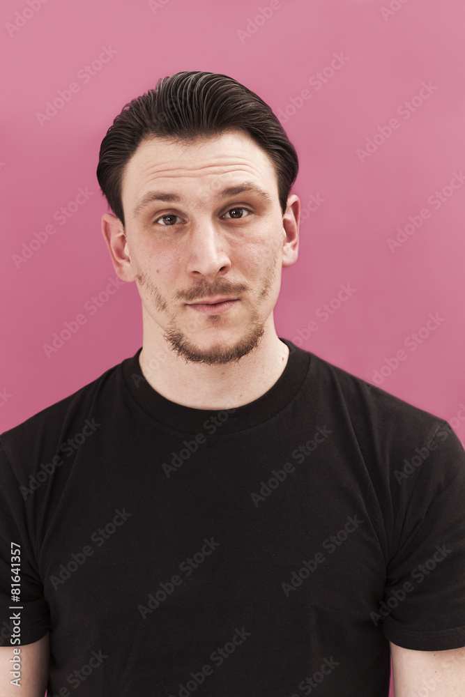 Handsome man portrait smiling on pink background Handsome man portrait smiling on pink background