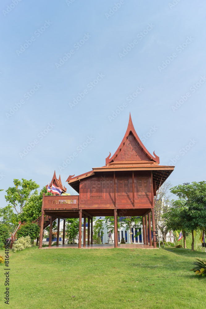 The traditional Thai wooden house under sunlight The traditional Thai wooden house under sunlight