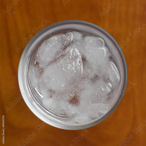Top view of glasse of water with ice.