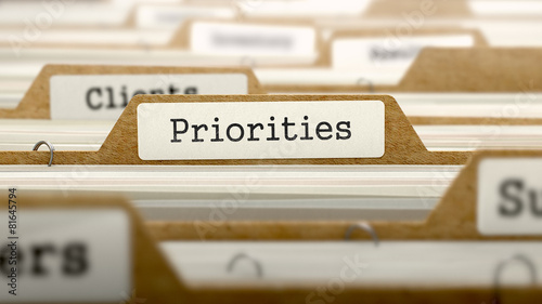 Priorities Concept with Word on Folder. photo